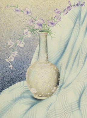 Decorative vase with flowers on a textured fabric background