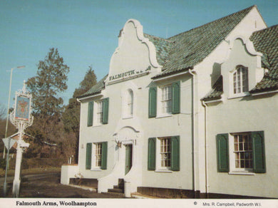 Falmouth Arms pub with green shutters and sign in Woolhampton