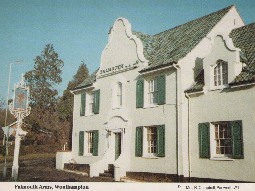 Falmouth Arms pub with green shutters and sign in Woolhampton