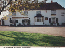 Load image into Gallery viewer, Pub named &#39;Three Kings Jacks Booth&#39; with white walls and black roof, surrounded by green grass and trees.

