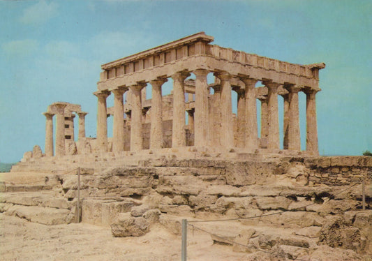 Ancient temple with columns against a blue sky