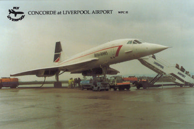 Concorde airplane at Liverpool Airport with visible branding and airport infrastructure.