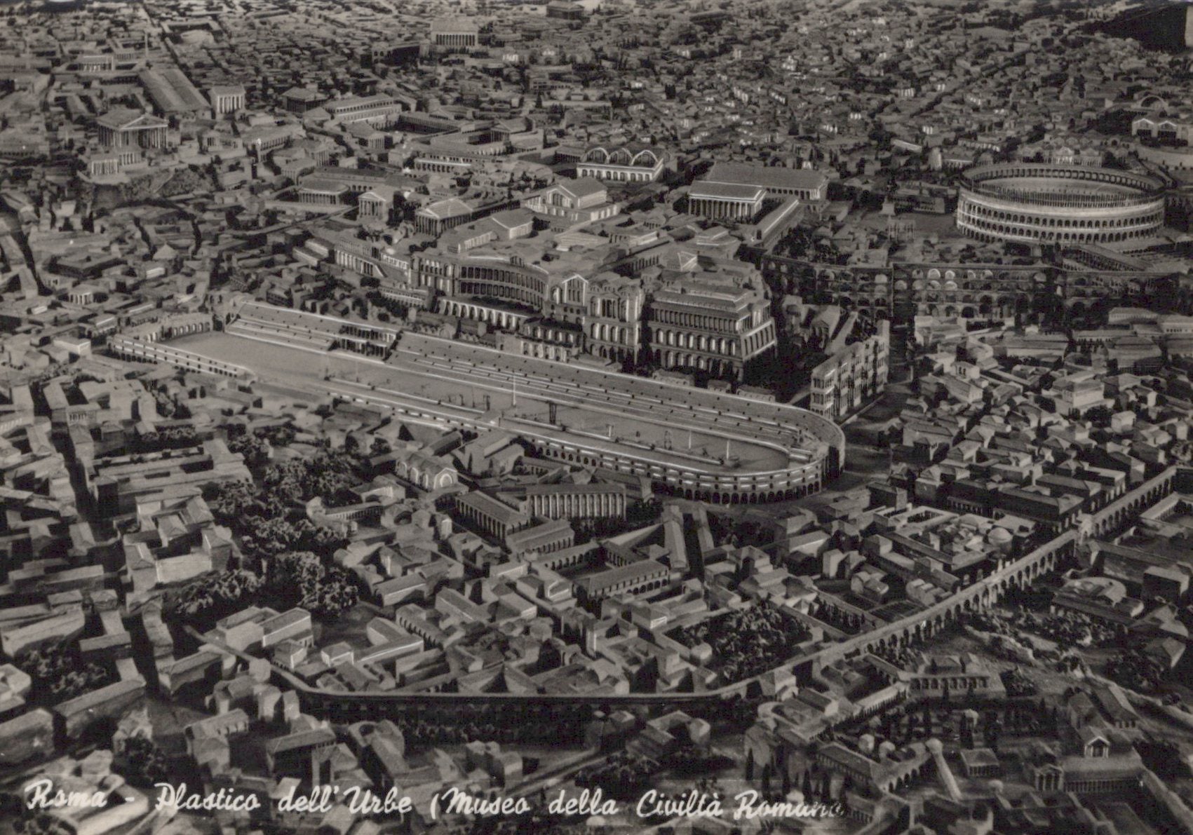 Aerial view of ancient Roman city with Colosseum and other landmarks