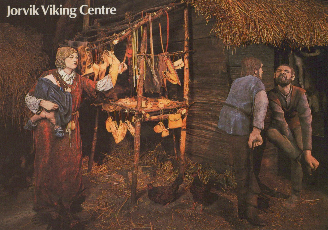 Illustration of a Viking scene with people around a wooden stand, featuring the Jorvik Viking Centre logo.