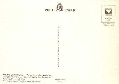 Back of a postcard with text and a logo on a beige background