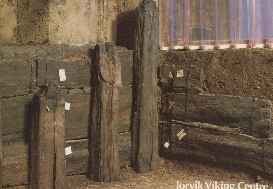 Wooden planks stacked against a wall with 'Jorvik Viking Centre' branding.