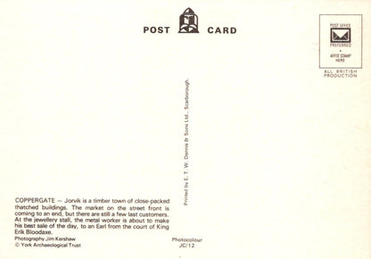 Back of a postcard with text and a logo on a white background
