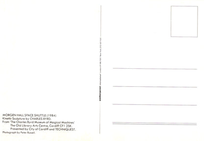 Back of a postcard with text and a small square image on a white background