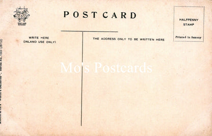 Back of a vintage postcard with text and a stamp impression