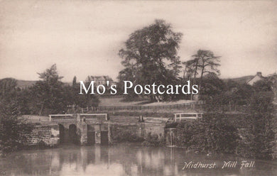 Vintage-style image of a bridge over water with trees in the background, featuring 'Mo's Postcards' text.