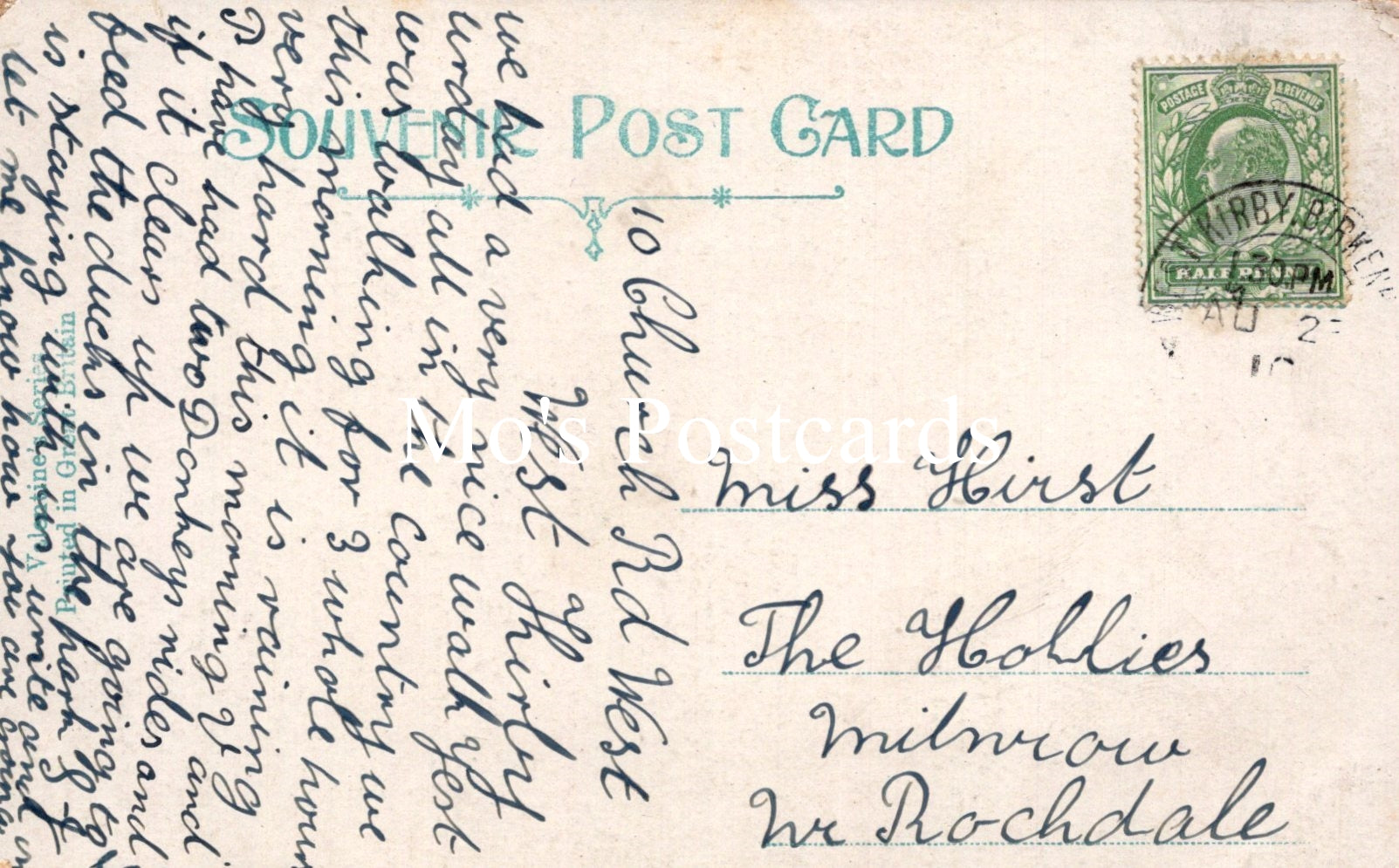 Vintage postcard with text and a stamp on a light brown background