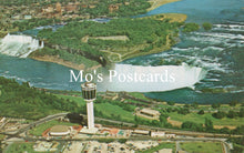 Load image into Gallery viewer, Aerial view of Niagara Falls with a prominent tower, labeled &#39;Mo&#39;s Postcards&#39;.
