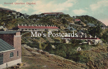 Load image into Gallery viewer, Vintage-style image of a hilly landscape with buildings and &#39;Mo&#39;s Postcards&#39; text overlay.
