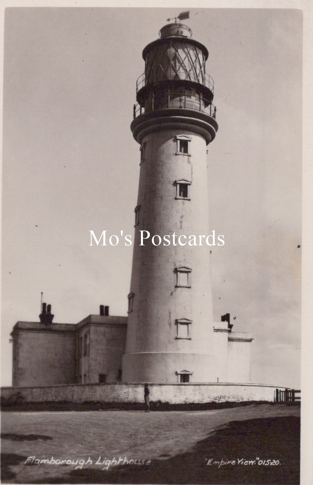 Vintage black and white photo of a lighthouse with 'Mo's Postcards' branding.