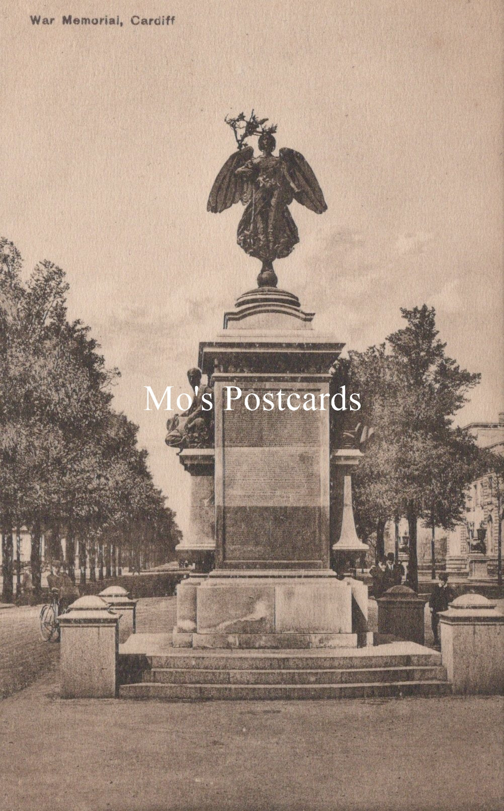 Vintage postcard of a War Memorial with an angel statue in the center, surrounded by trees.