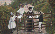 Load image into Gallery viewer, Vintage postcard with a family by a wooden gate in a garden, featuring the text &#39;Mo&#39;s Postcards&#39;.
