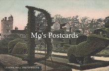 Load image into Gallery viewer, Topiary garden with shaped bushes in the shape of a chair and table, with &#39;Mo&#39;s Postcards&#39; text overlay.
