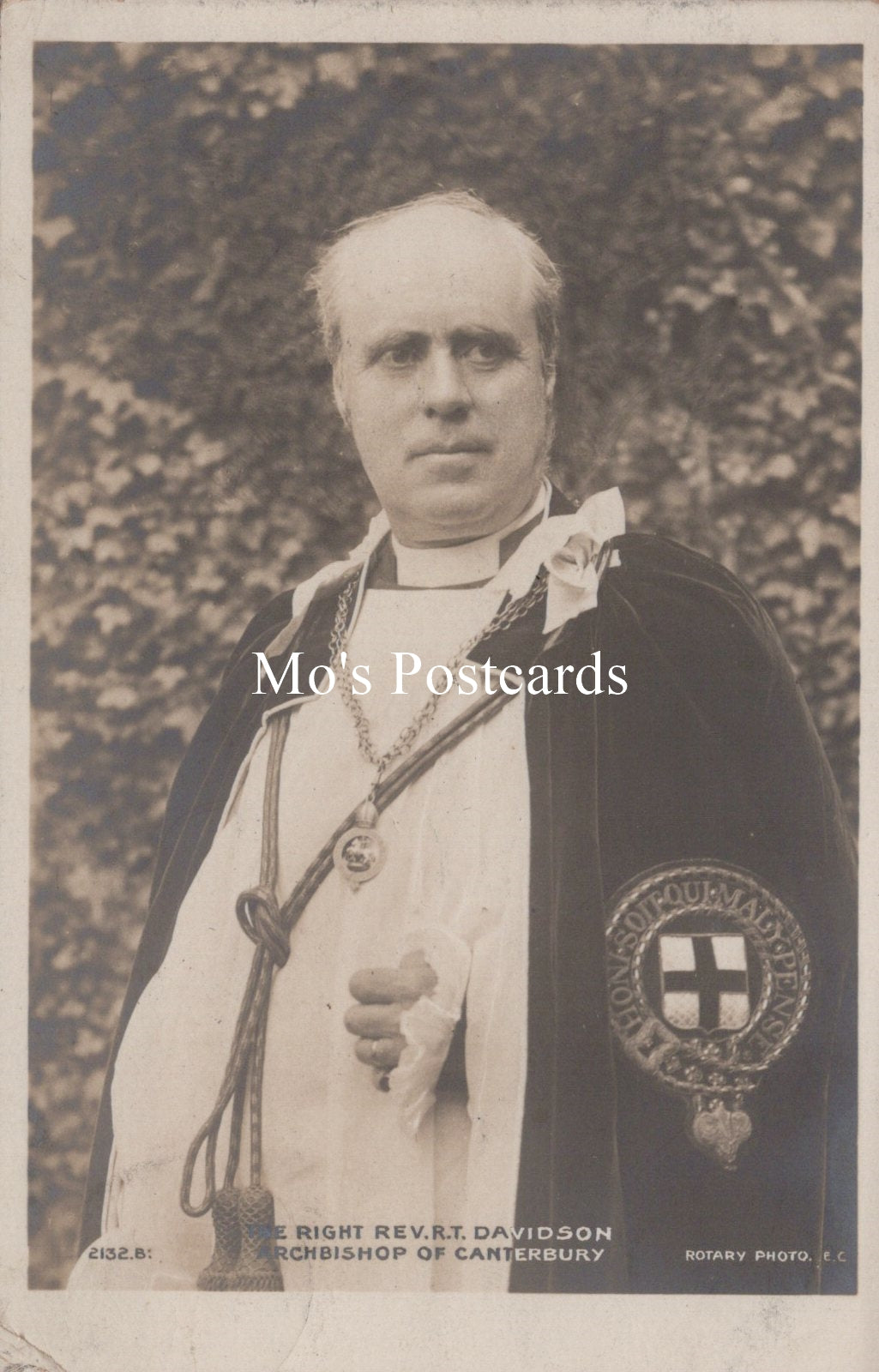 Vintage photograph of a clergyman with a decorative stole against a textured background