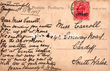 Load image into Gallery viewer, Vintage postcard with text and a red stamp, addressed to Miss Carroll in Cardiff, South Wales.
