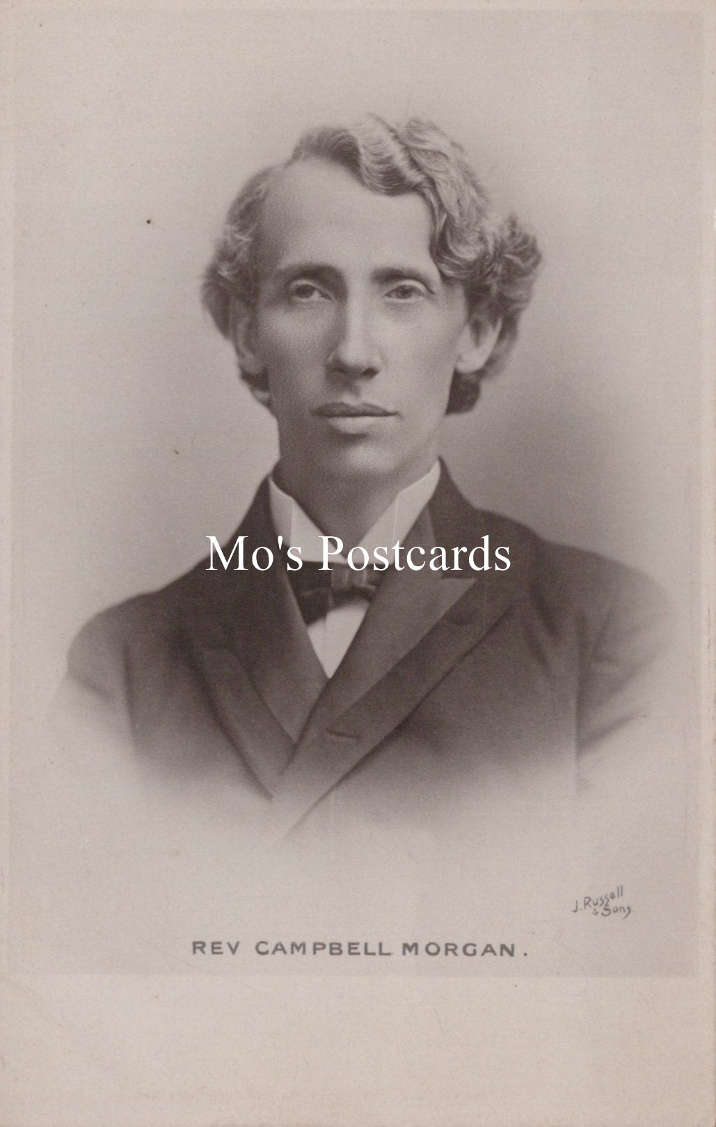 Vintage black and white portrait of a man with 'Mo's Postcards' text overlay