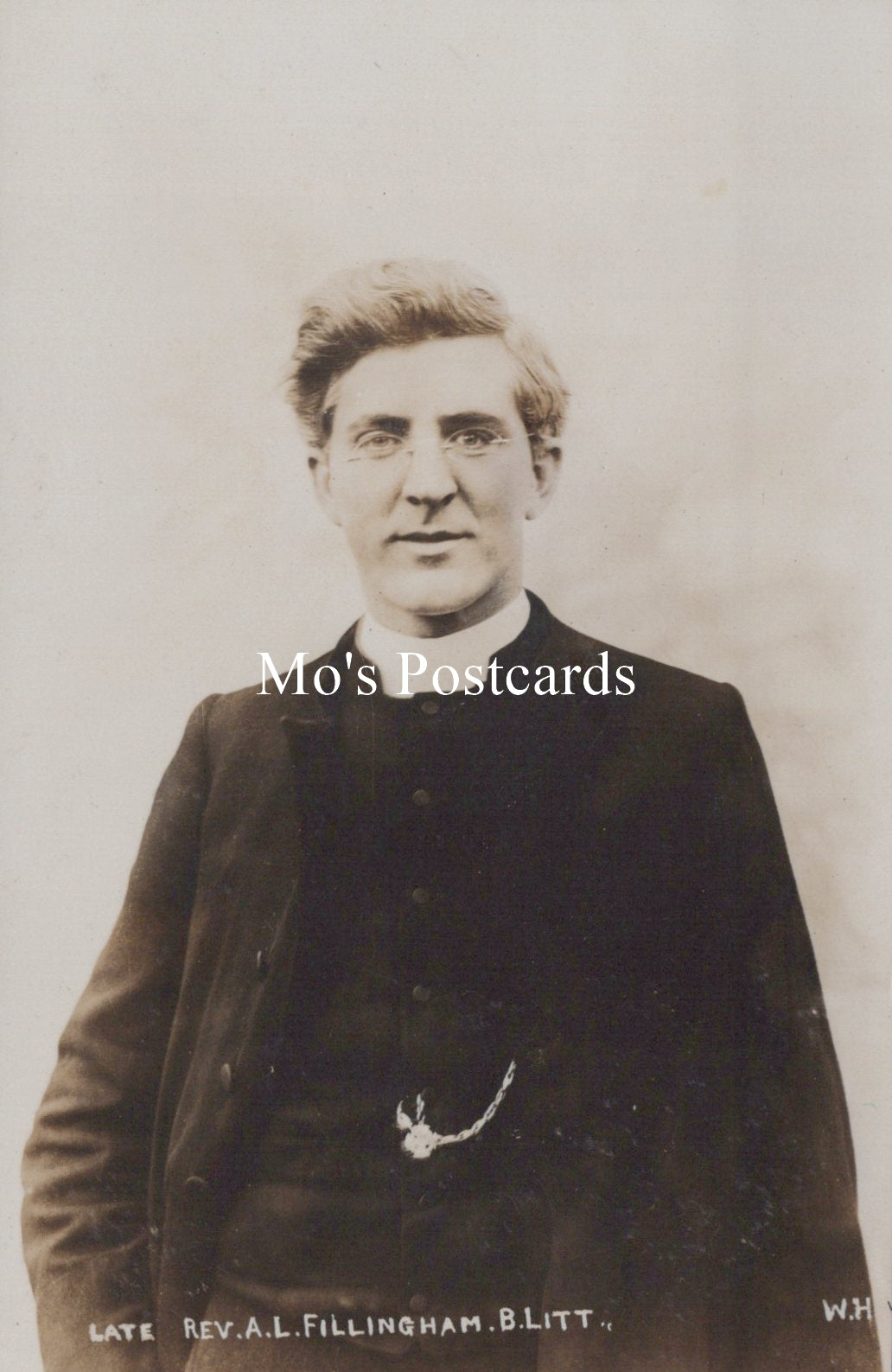 Vintage black and white photograph of a man in formal attire with 'Mo's Postcards' text overlay.