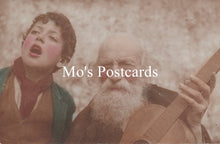 Load image into Gallery viewer, Two people, one singing and the other playing a guitar, with &#39;Mo&#39;s Postcards&#39; text overlay.
