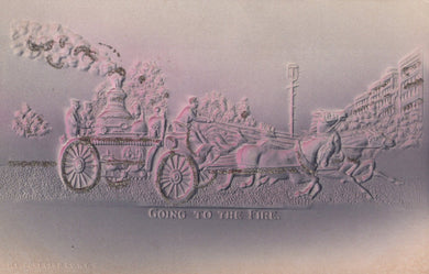 Carved stone scene of a horse-drawn carriage with text 'Going to the Fire' on a textured surface.