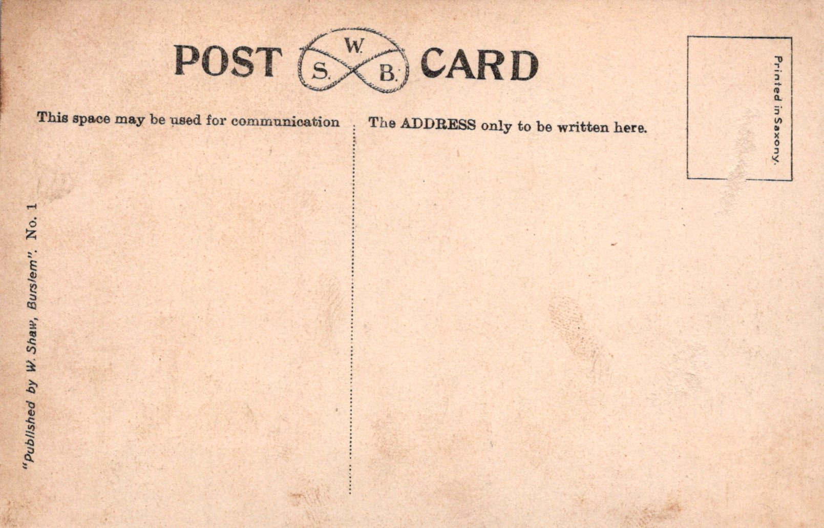 Back of a vintage postcard with typographic design and text.