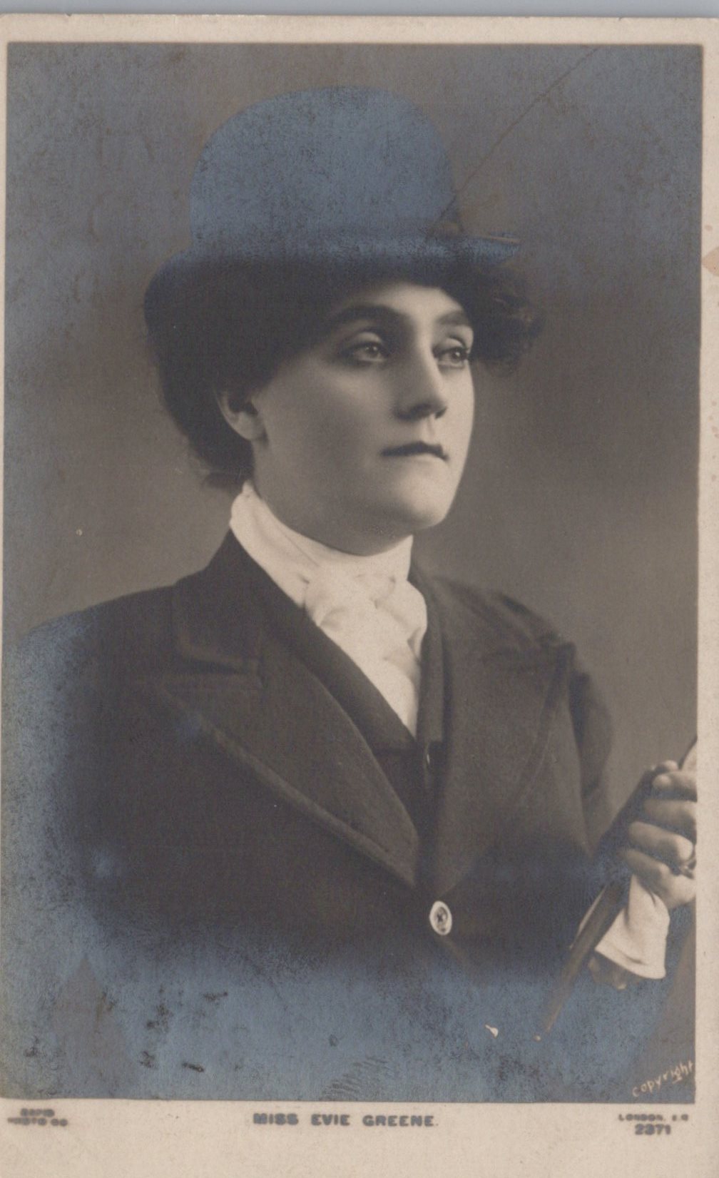Vintage photograph of a woman wearing a hat and formal attire