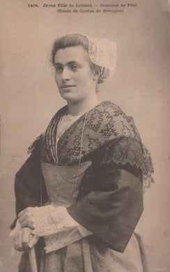 Vintage photograph of a woman in traditional costume from Lorient, France.