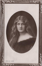 Load image into Gallery viewer, Vintage black and white portrait of a woman with long hair, framed in ornate style.
