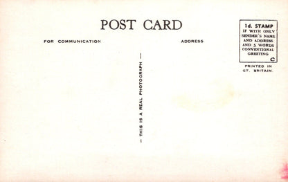 Vintage postcard with text and a stamp area on a light background