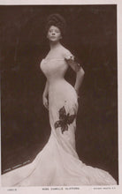 Load image into Gallery viewer, Vintage photograph of a woman in an elegant gown with a butterfly design, against a dark background.
