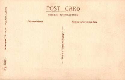 Vintage postcard with text fields for correspondence and address on a beige background