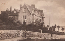 Load image into Gallery viewer, Vintage postcard of Mount Prospect Hotel in Penzance, featuring a large building with a street lamp and stone wall.

