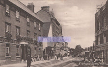 Load image into Gallery viewer, Vintage black and white photograph of a street scene with buildings and pedestrians in Bishop&#39;s Stortford.
