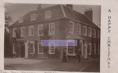 Vintage black and white postcard of a large house with a person and horse-drawn carriage in front, featuring 'M's Postcards' branding.