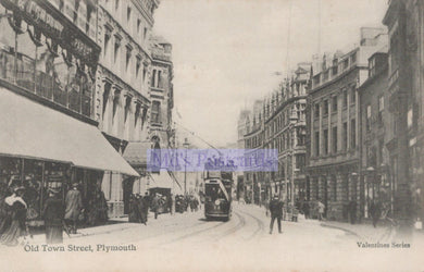 Vintage black and white photograph of Old Town Street in Plymouth with trams and pedestrians.