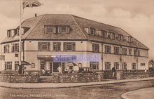 Load image into Gallery viewer, Vintage black and white postcard of The Marvic Private Hotel in Walsall with a British flag.
