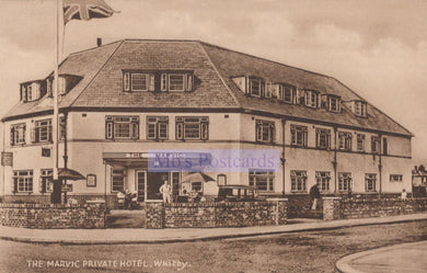Vintage black and white postcard of The Marvic Private Hotel in Walsall with a British flag.