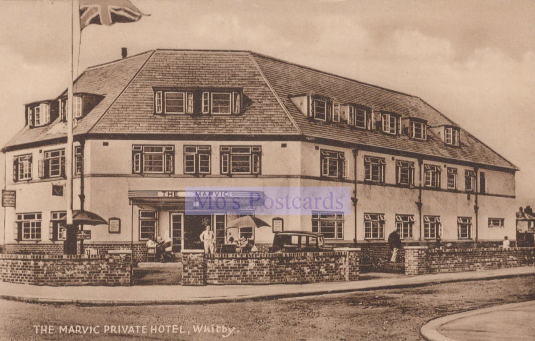 Vintage black and white postcard of The Marvic Private Hotel in Walsall with a British flag.