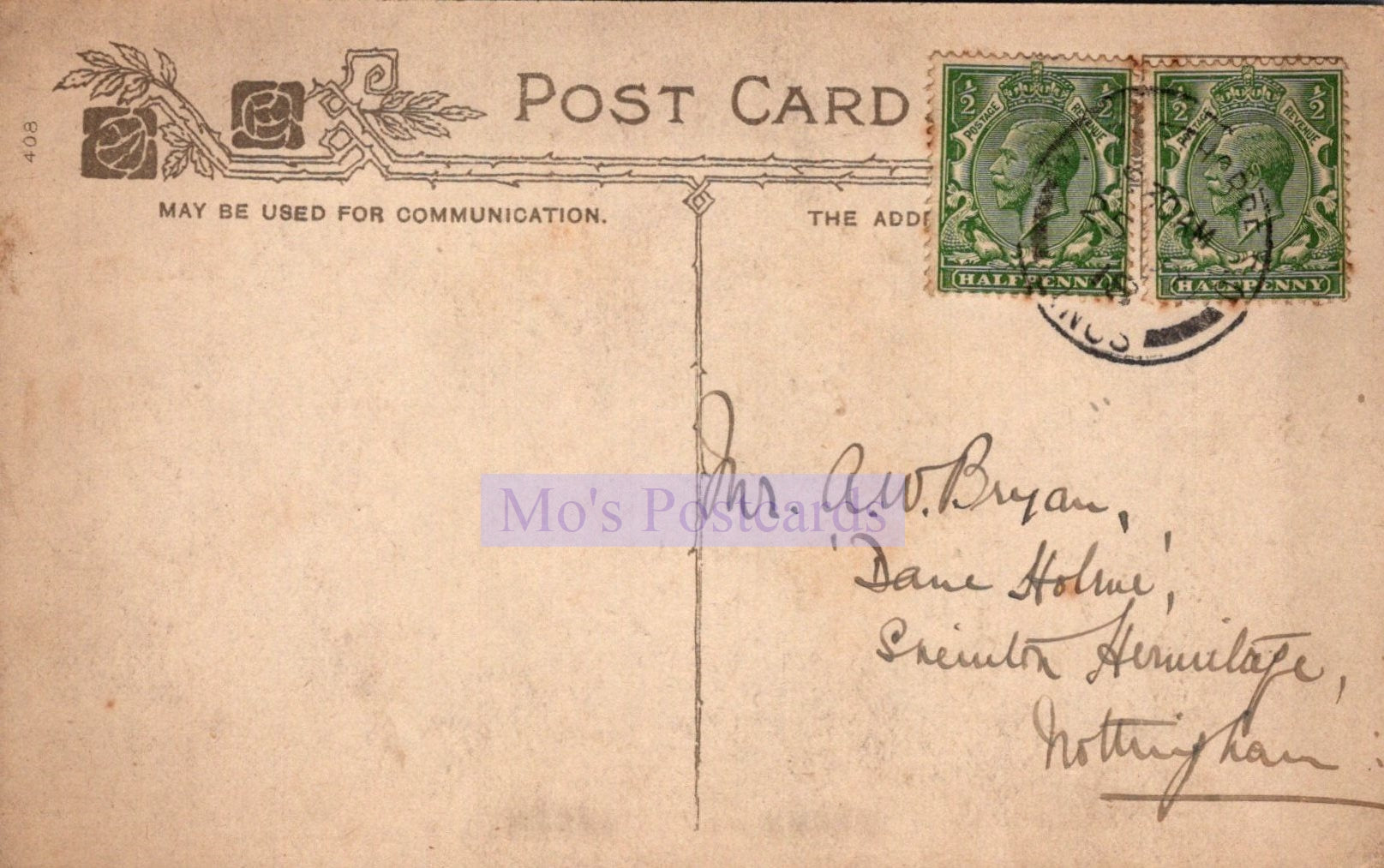 Vintage postcard with stamps and handwritten address on a beige background