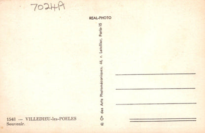 Vintage postcard back with text and a stamp on a beige background