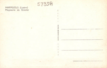 Back of a postcard with text and a grid for writing, on a beige background.