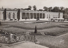 Load image into Gallery viewer, Historical black and white photograph of a grand building with gardens and people around
