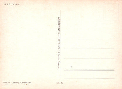Vintage postcard with text and a photo credit on a light pink background