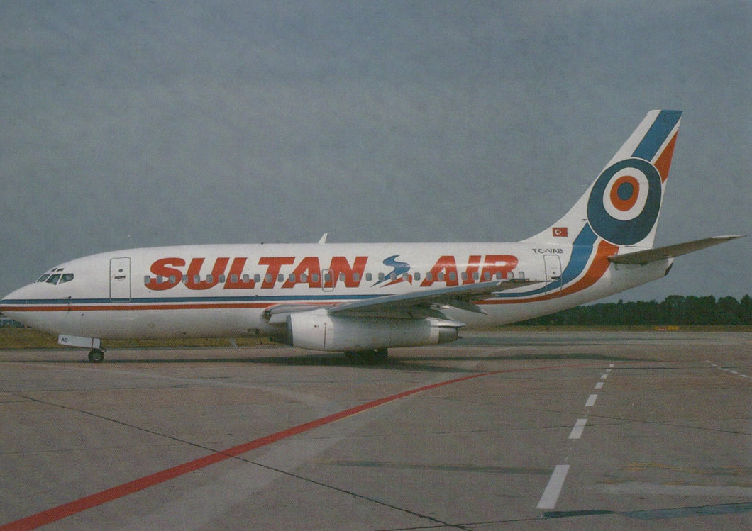 Sultan Air airplane on a runway with a clear sky background