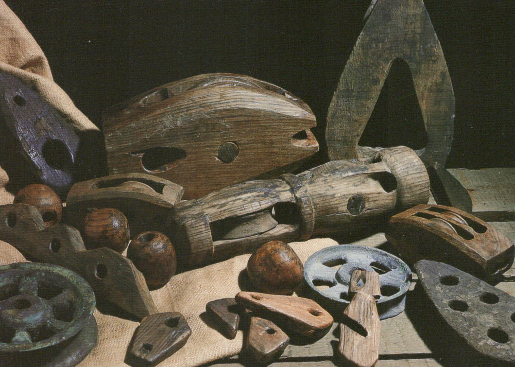 Collection of rustic tools and mechanical parts on a dark background
