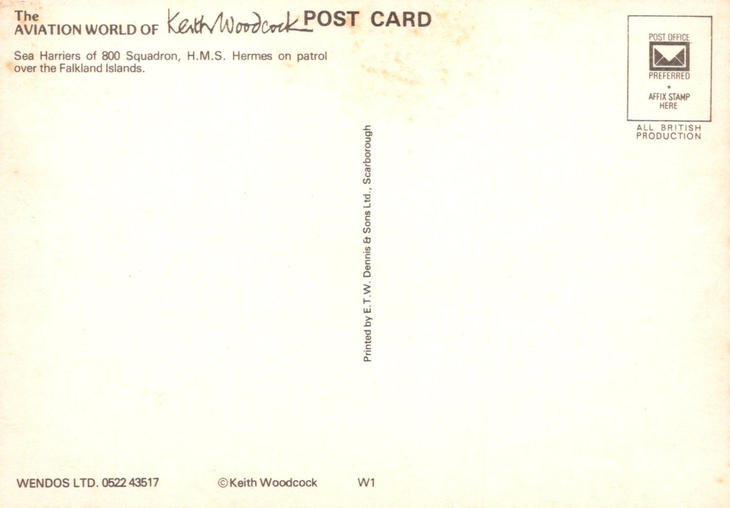 Back of a postcard with text and a logo, featuring a light yellow background.