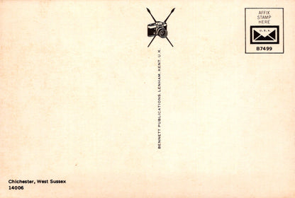 Vintage-style envelope with camera icon and text on a beige background